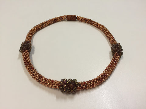 Beautiful hand-crafted bronze and golden necklace with wine coloured treats